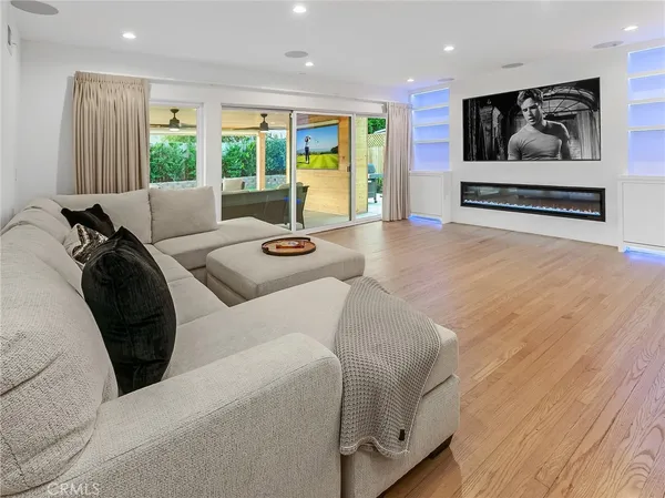 a living room with furniture and windows