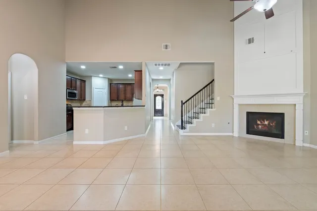a kitchen with stainless steel appliances granite countertop a refrigerator and a stove