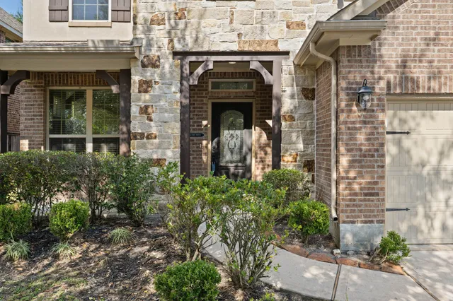 a view of a hallway with entryway door