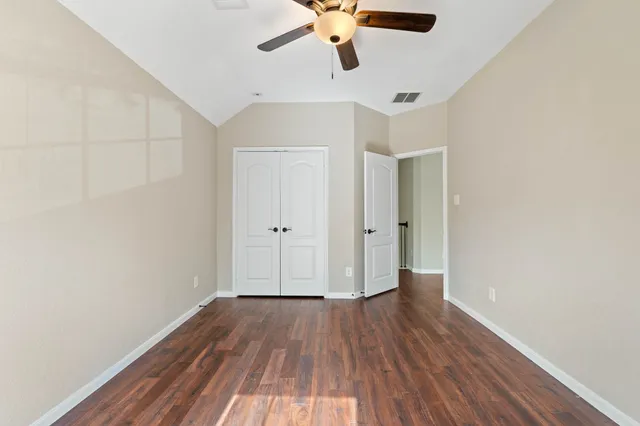 a bathroom with a granite countertop sink a toilet and a bathtub