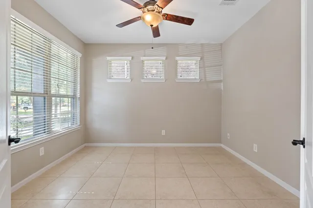 a view of a hallway with wooden shelves