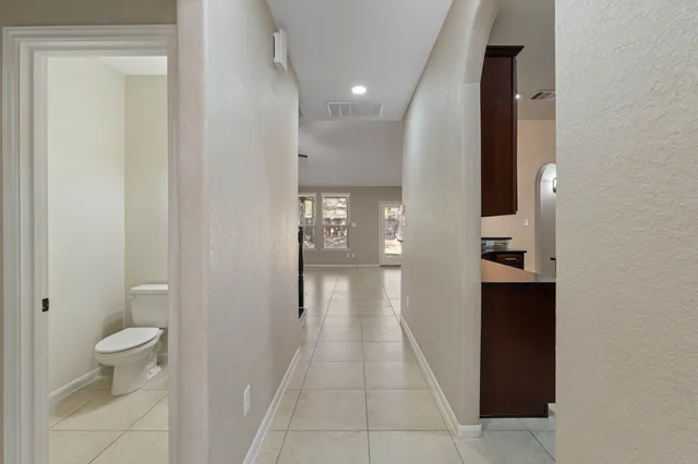 a view of entryway with wooden floor and stairs