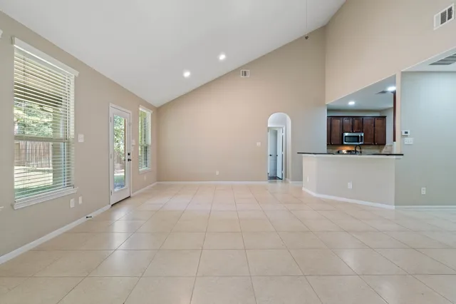 a view of a kitchen with furniture and a fireplace