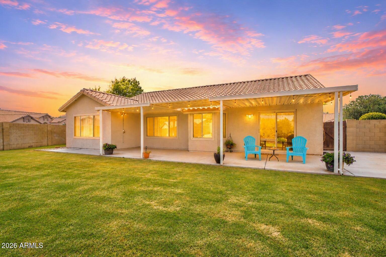 739 South Cholla Street Gilbert, AZ 85233 - Photo 17 of 30 Backyard & Covered Patio Twilight
