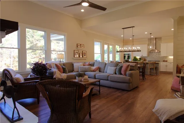 a view of a livingroom with wooden floor and a window