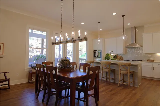 a kitchen with cabinets a counter space stainless steel appliances and cabinets