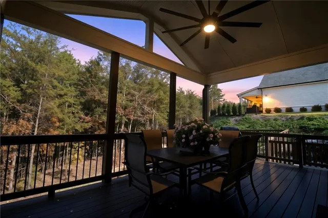 a view of a chairs and table in the balcony