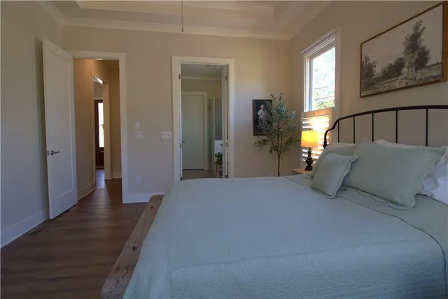 a spacious bathroom with a double vanity sink a mirror and a shower