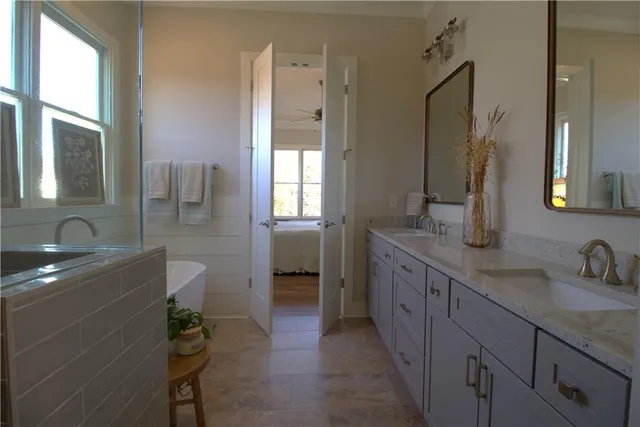 a bathroom with a bathtub and shower