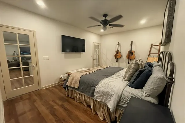 a bathroom with a tub a sink and mirror