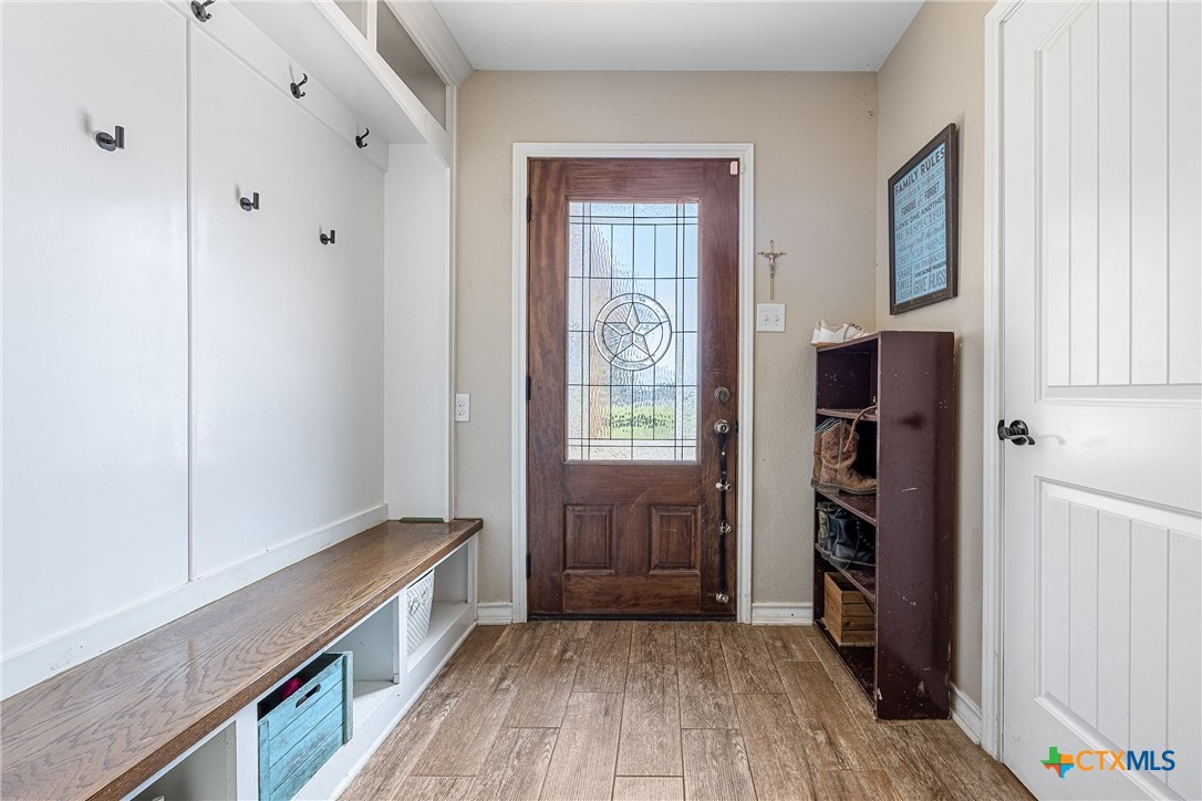 16101 Dove Road Moody, TX 76557 - Photo 8 of 42 a view of hallway with wooden floor and stairs