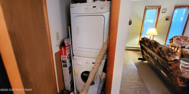 a view of a chairs and table in the balcony