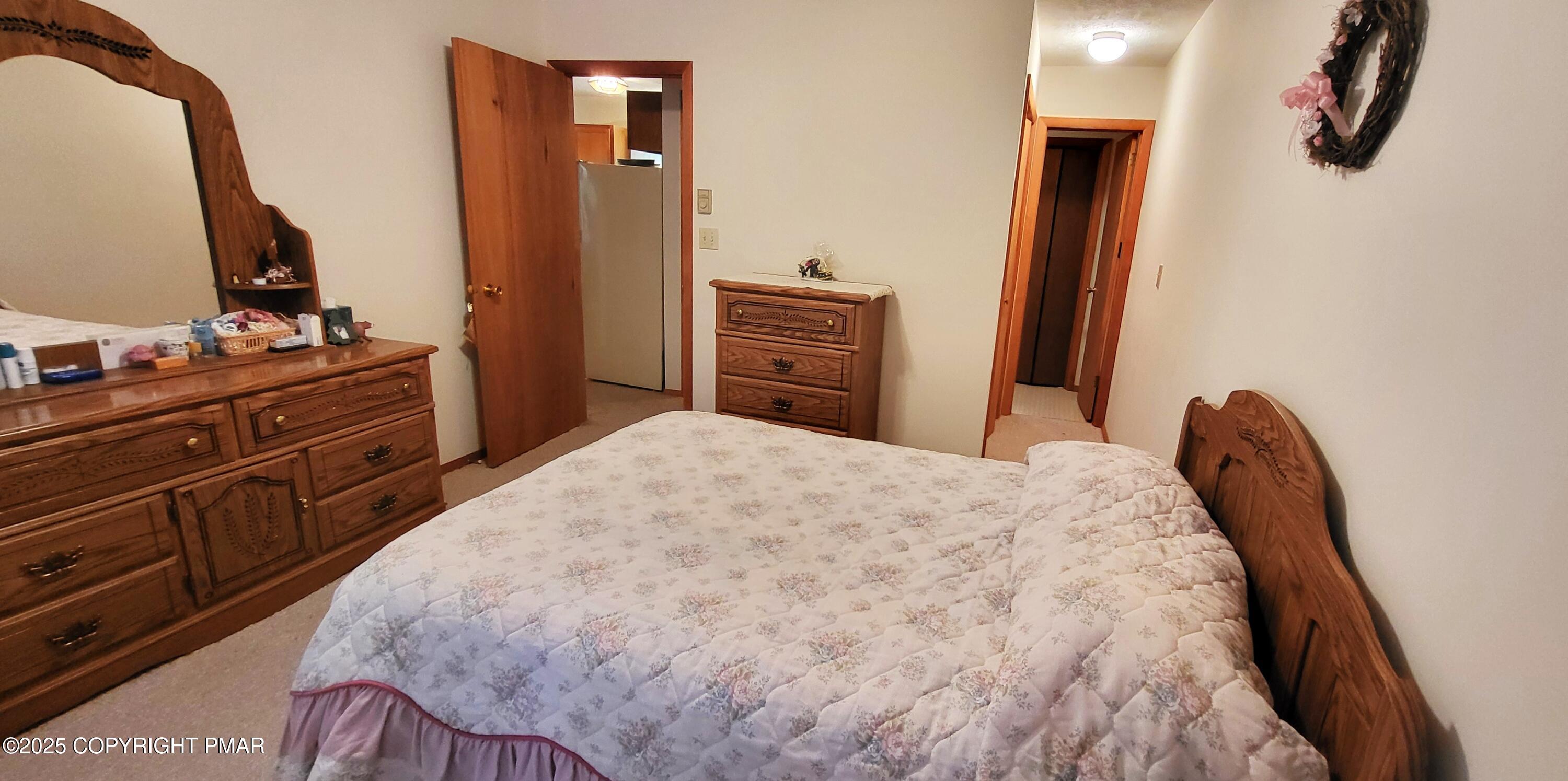 188 Radcliff Road Bushkill, PA 18324 - Photo 14 of 51 a bedroom with a bed and a dresser in it