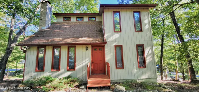 a bedroom with a bed and a dresser in it
