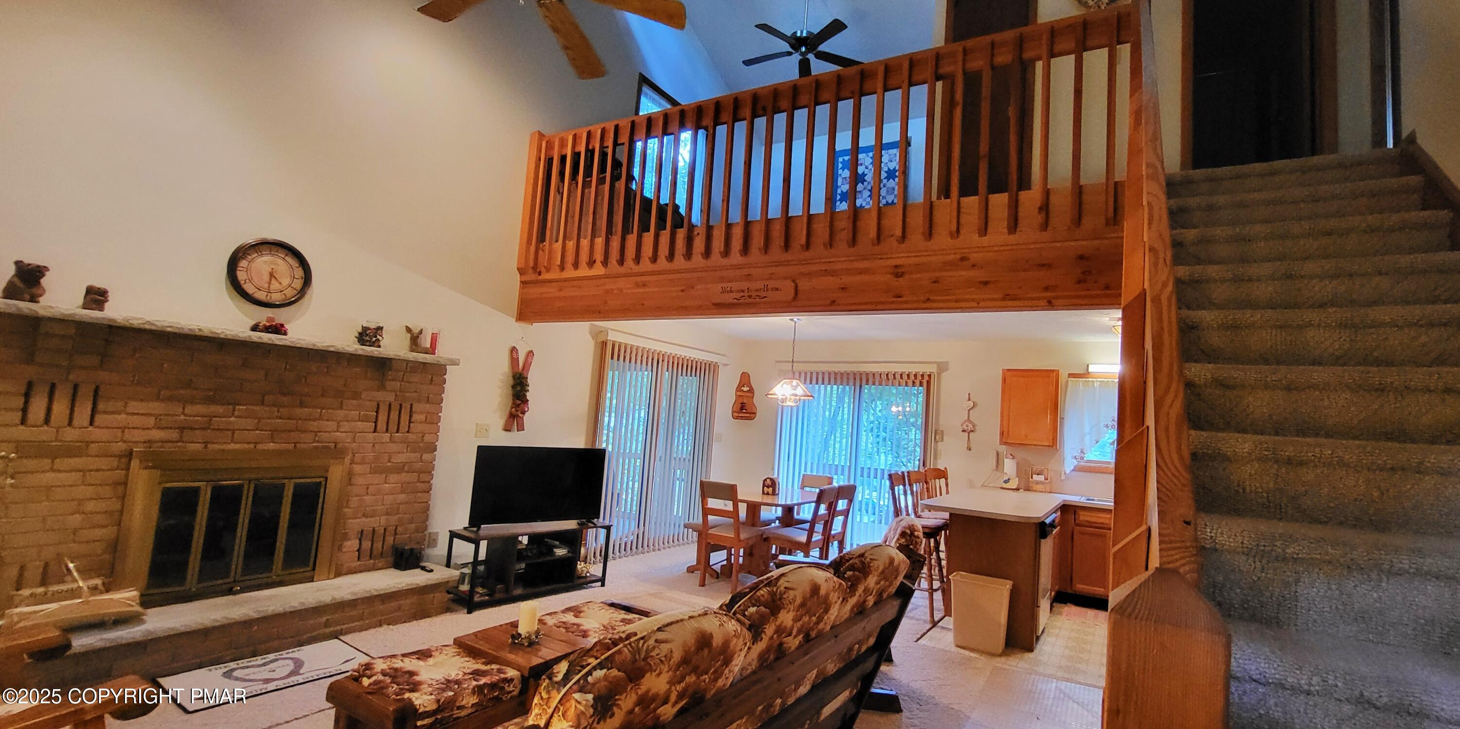 188 Radcliff Road Bushkill, PA 18324 - Photo 4 of 51 a view of a livingroom with furniture and a fireplace