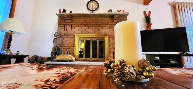 a view of balcony with wooden floor and fence