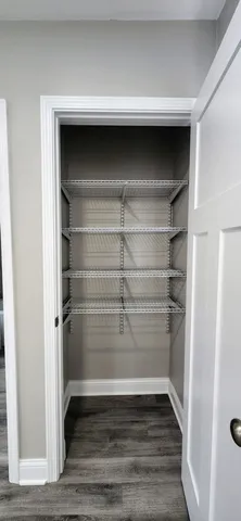 a view of a room with racks on the wall