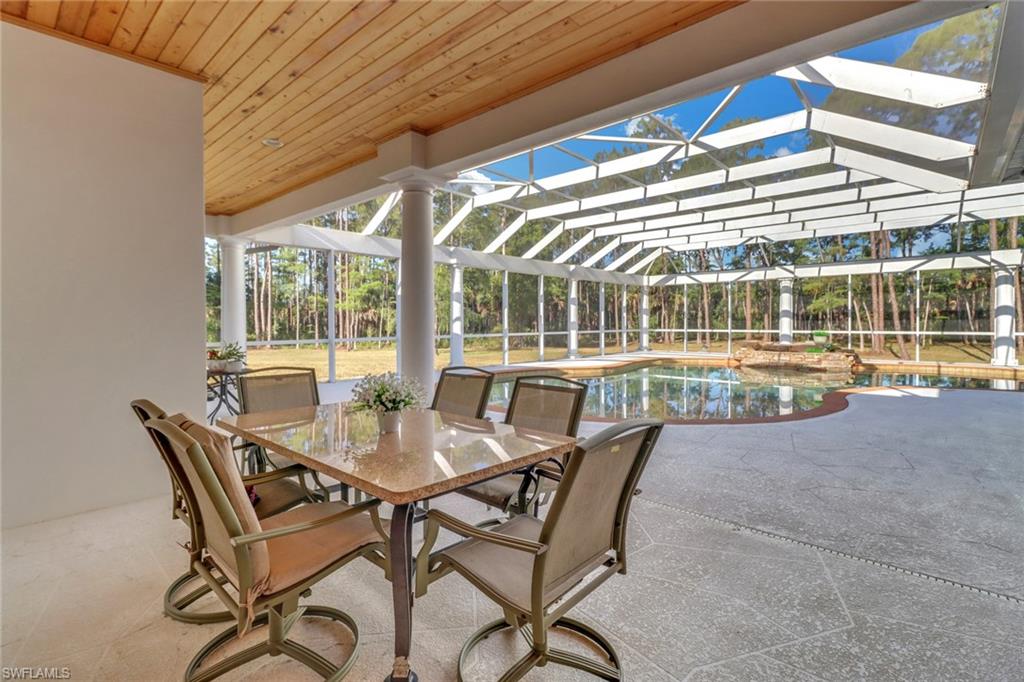 2825 Jenkins Way Naples, FL 34117 - Photo 34 of 50 a dining room with furniture and window