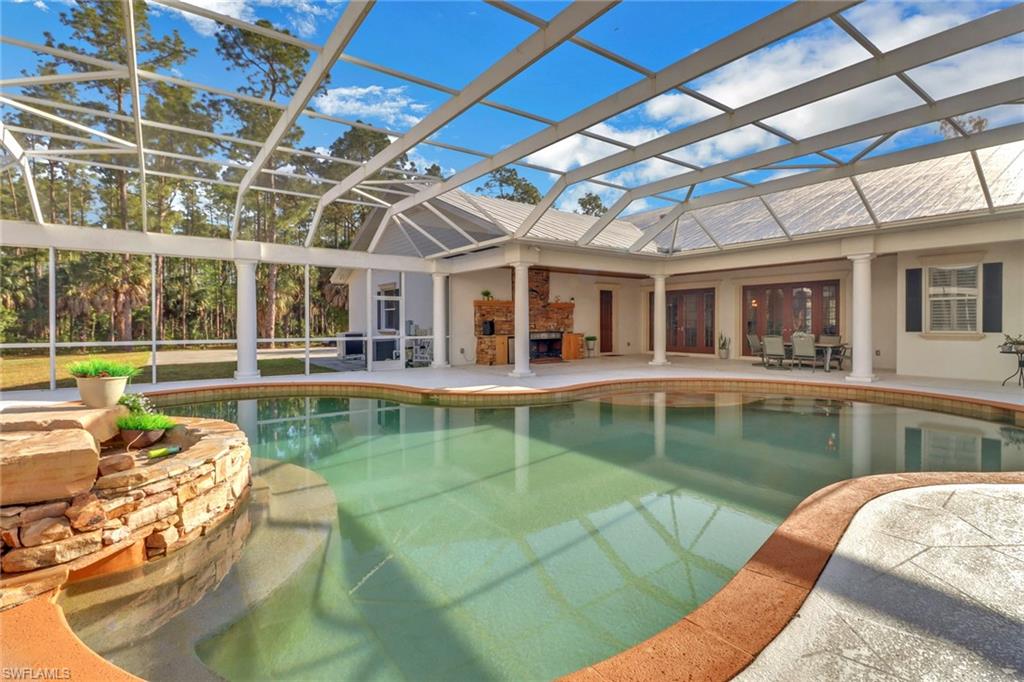 2825 Jenkins Way Naples, FL 34117 - Photo 37 of 50 a view of a swimming pool with a patio