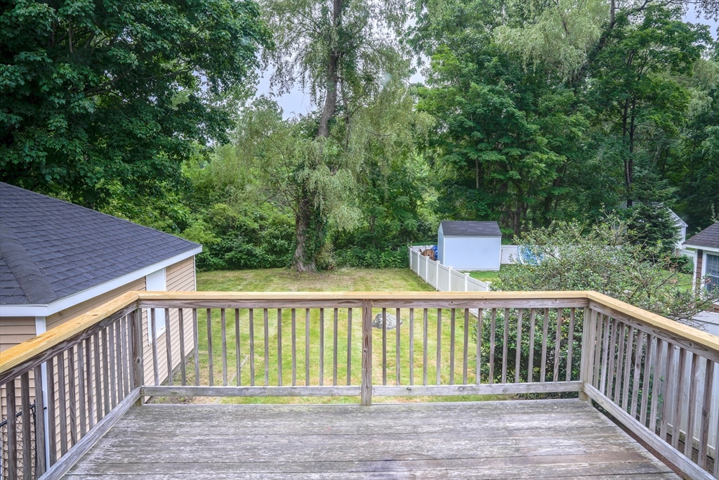 32 Dale Street Franklin, MA 02038 - Photo 10 of 11 a view of a wooden fence and trees
