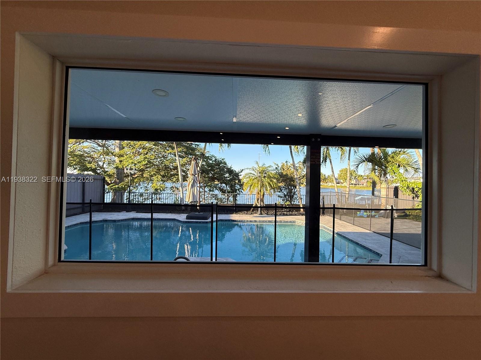 8335 Northwest 197th Terrace Hialeah, FL 33015 - Photo 14 of 51 a view of a lake from a window