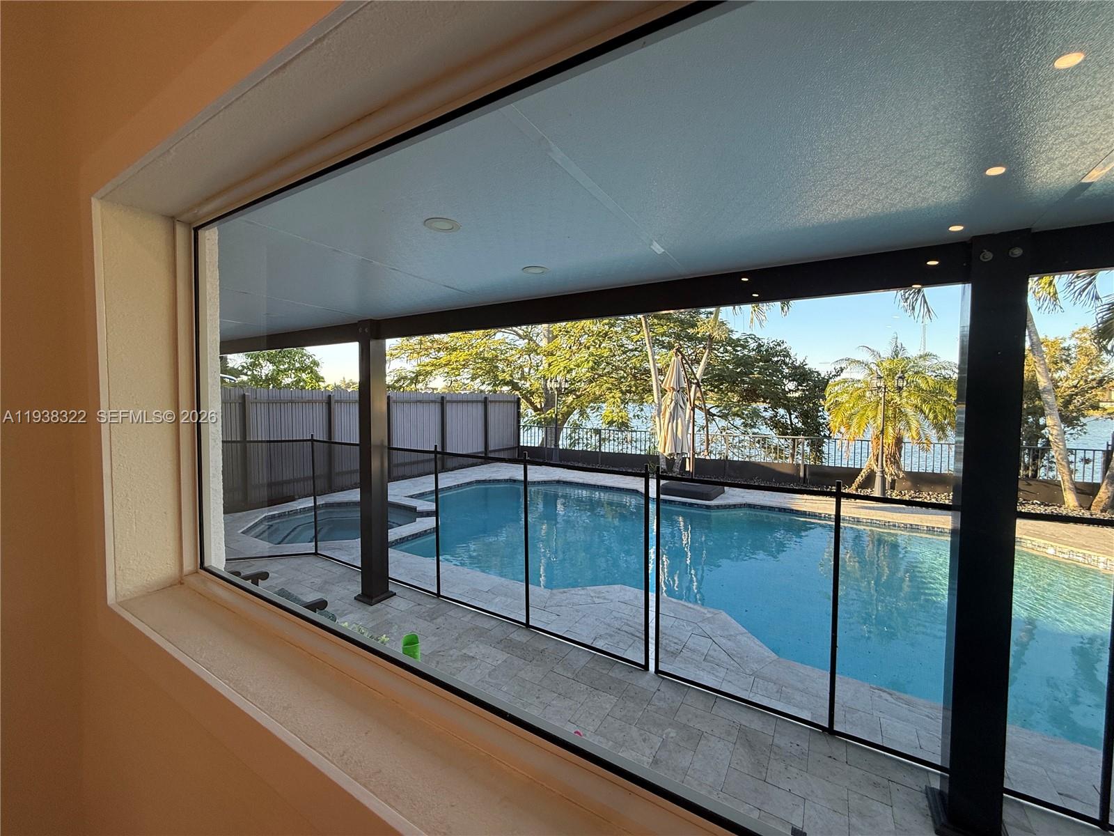 8335 Northwest 197th Terrace Hialeah, FL 33015 - Photo 15 of 51 a view of a floor to ceiling window and an outdoor view