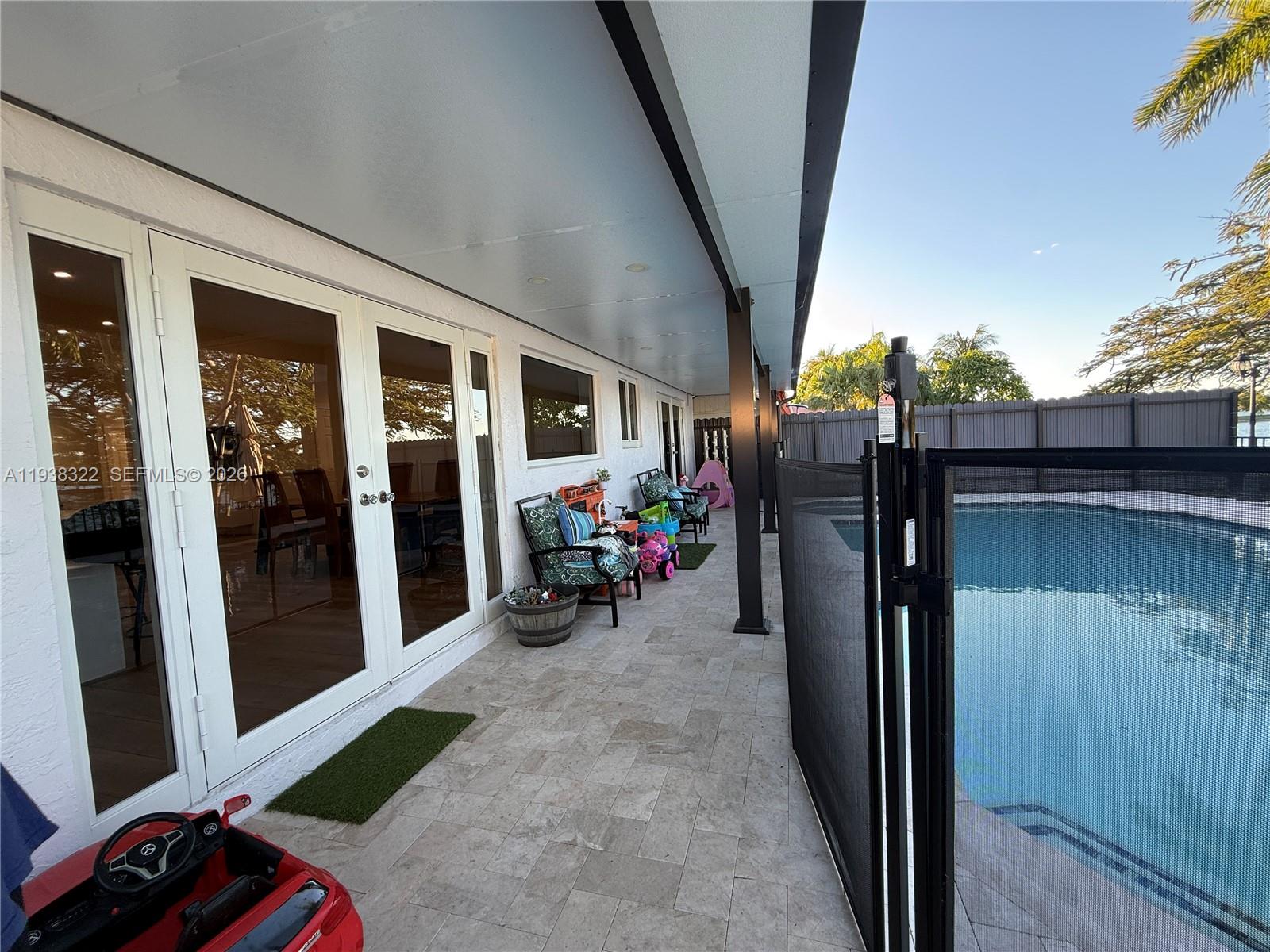 8335 Northwest 197th Terrace Hialeah, FL 33015 - Photo 17 of 51 a view of a porch with furniture