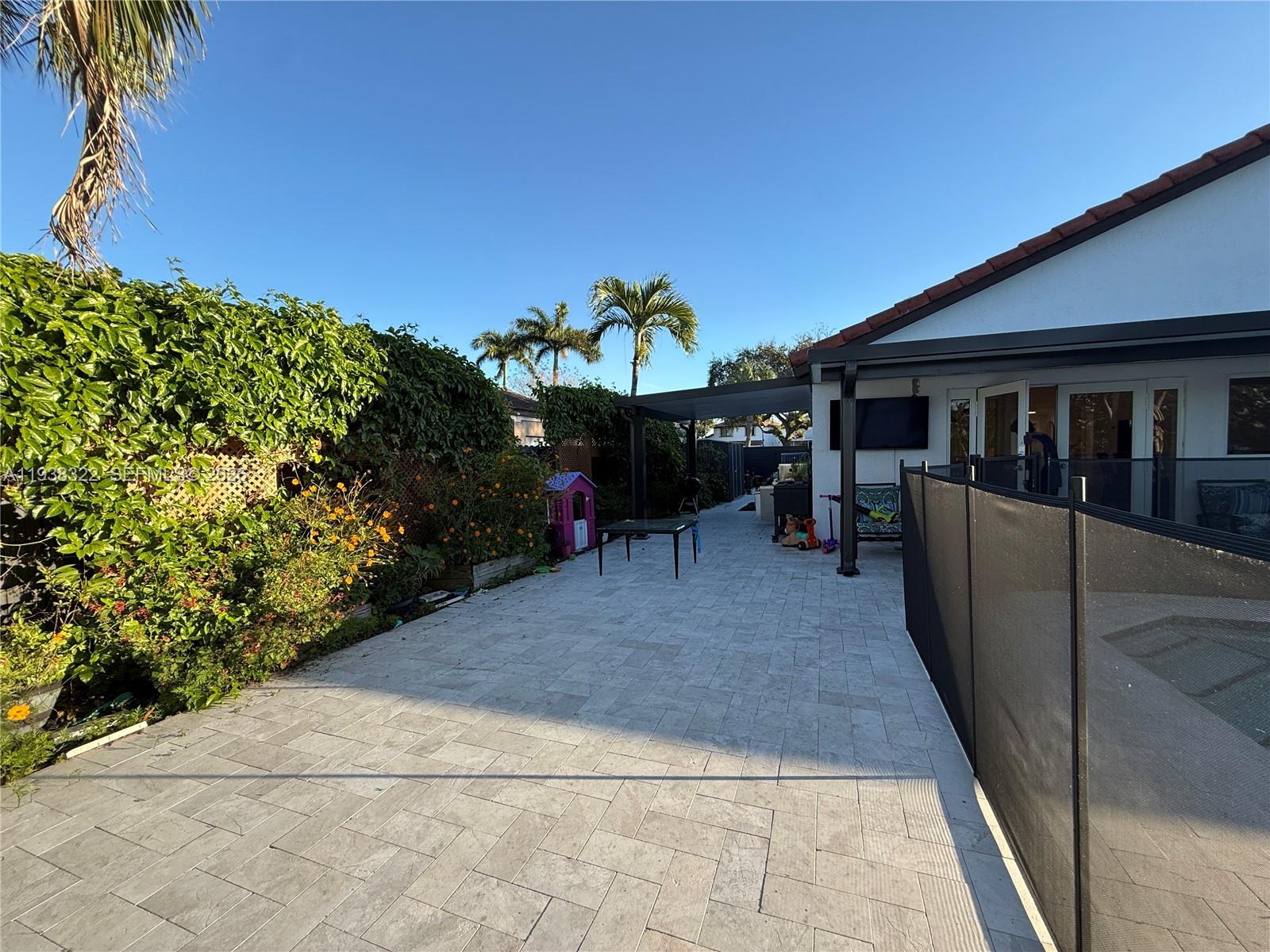 8335 Northwest 197th Terrace Hialeah, FL 33015 - Photo 21 of 51 a view of outdoor space and yard