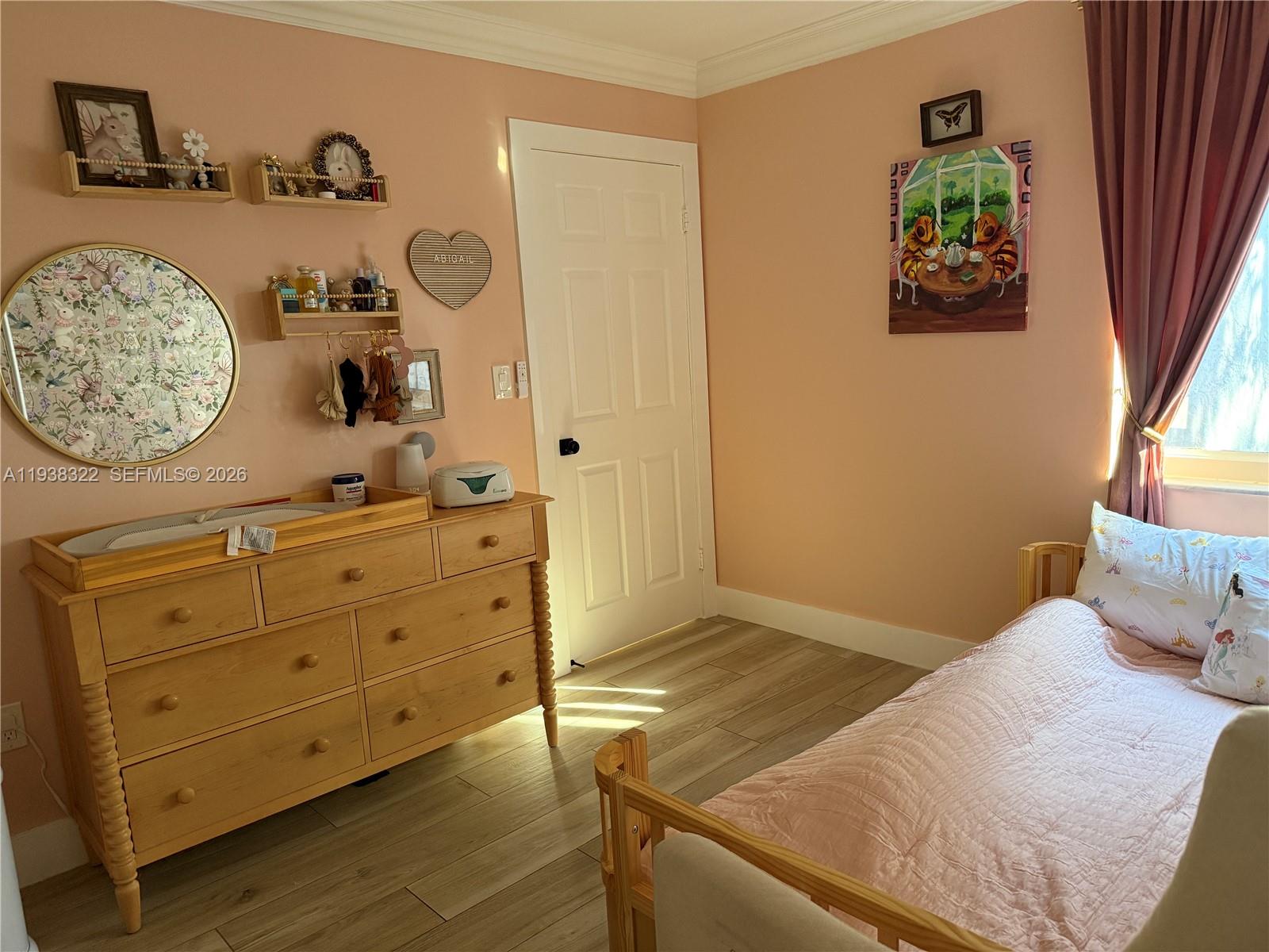 8335 Northwest 197th Terrace Hialeah, FL 33015 - Photo 37 of 51 a bedroom with a bed and a dresser in it