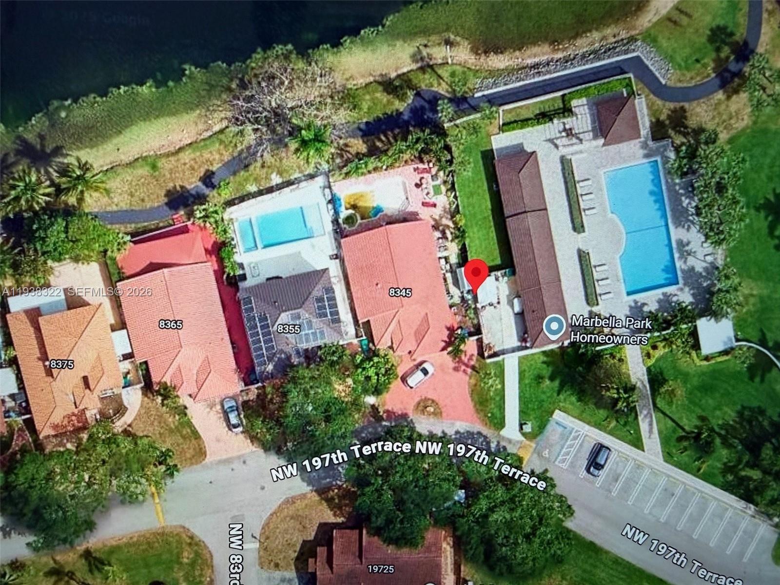 8335 Northwest 197th Terrace Hialeah, FL 33015 - Photo 40 of 51 an aerial view of a house with a yard and outdoor seating