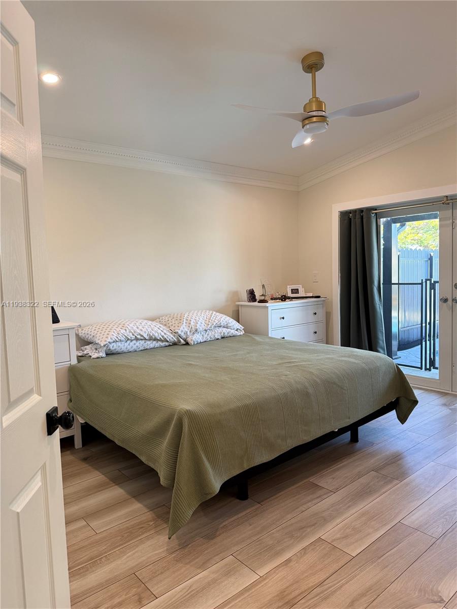 8335 Northwest 197th Terrace Hialeah, FL 33015 - Photo 41 of 51 a bedroom with a bed and window