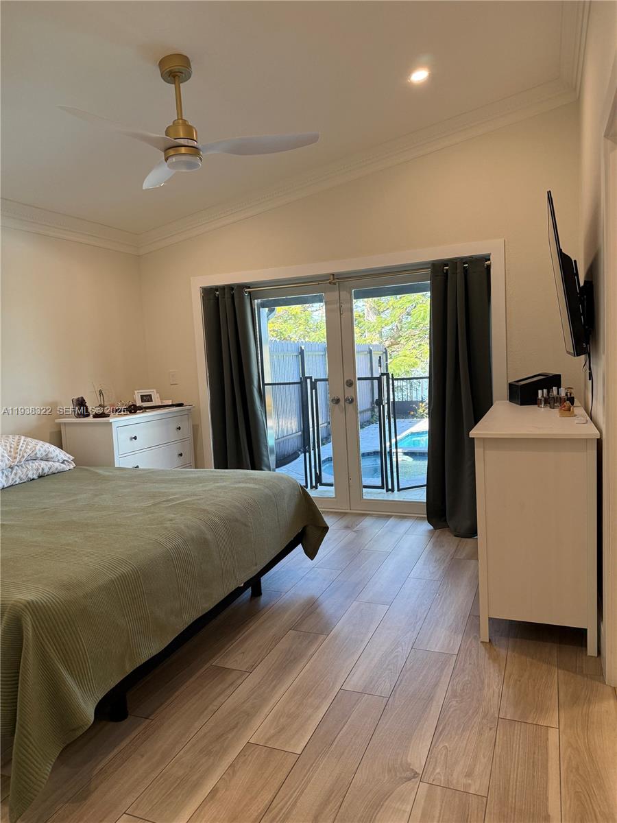 8335 Northwest 197th Terrace Hialeah, FL 33015 - Photo 42 of 51 a bedroom with a bed and large window