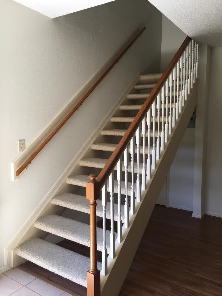 7575 Cambridge Street, Unit 1004 Houston, TX 77054 - Photo 12 of 23 a view of staircase with wooden floor and white walls