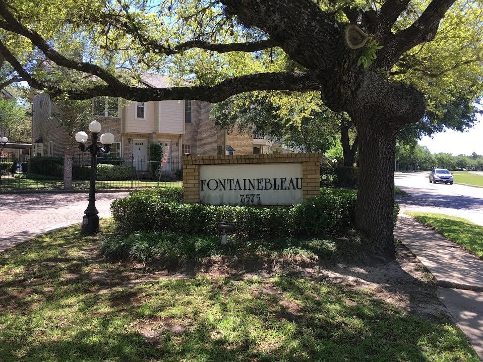 7575 Cambridge Street, Unit 1004 Houston, TX 77054 - Photo 23 of 23 a sign that is sitting in front of a tree