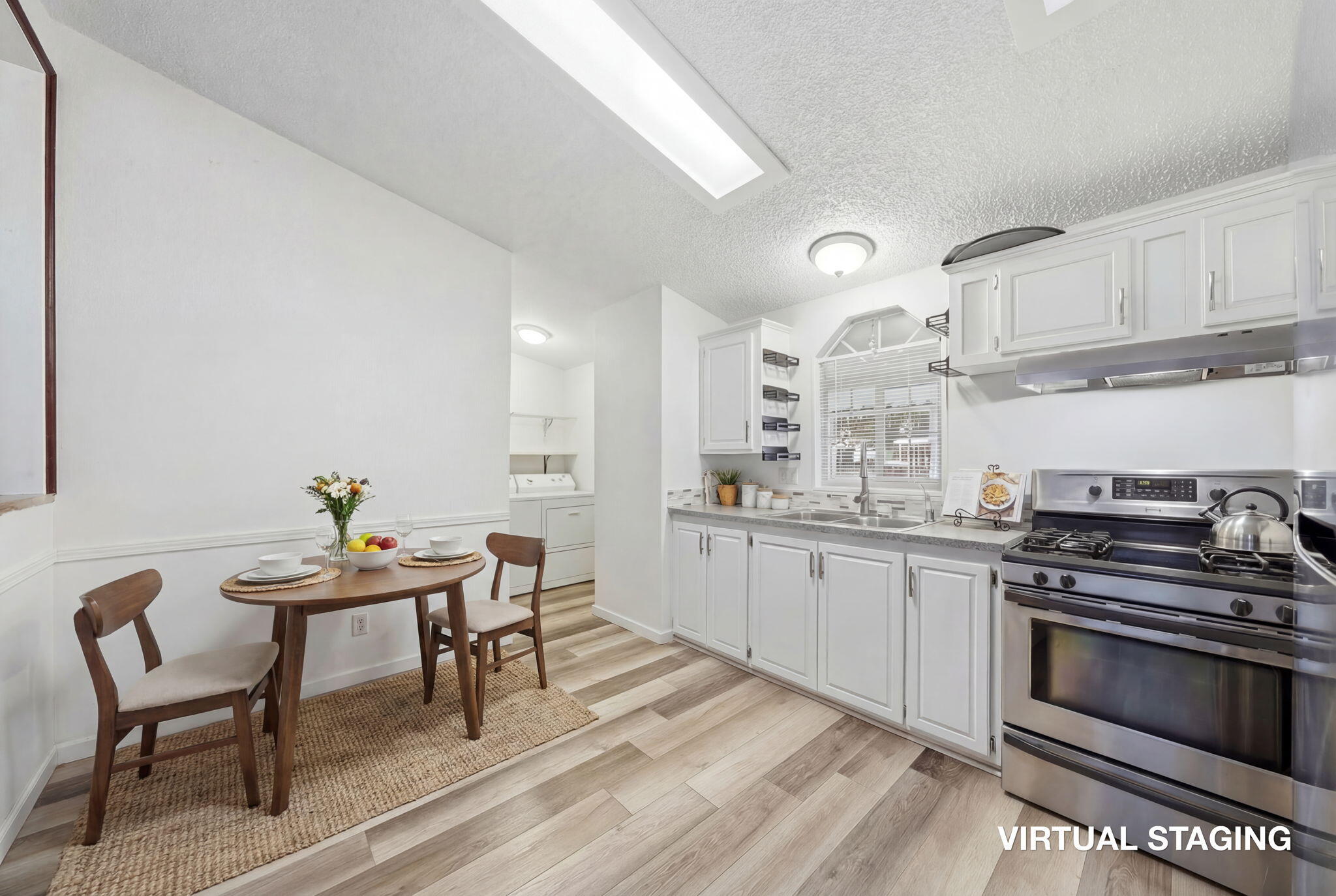 11705 Parey Avenue, Unit 7 Red Bluff, CA 96080 - Photo 15 of 34 a kitchen with granite countertop a stove a sink and chairs