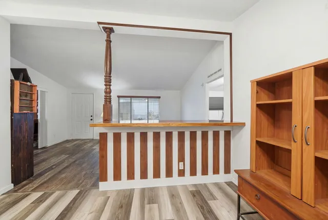 a bedroom with a bed couch and window