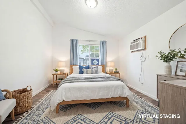 a view of a yard with plants and trees