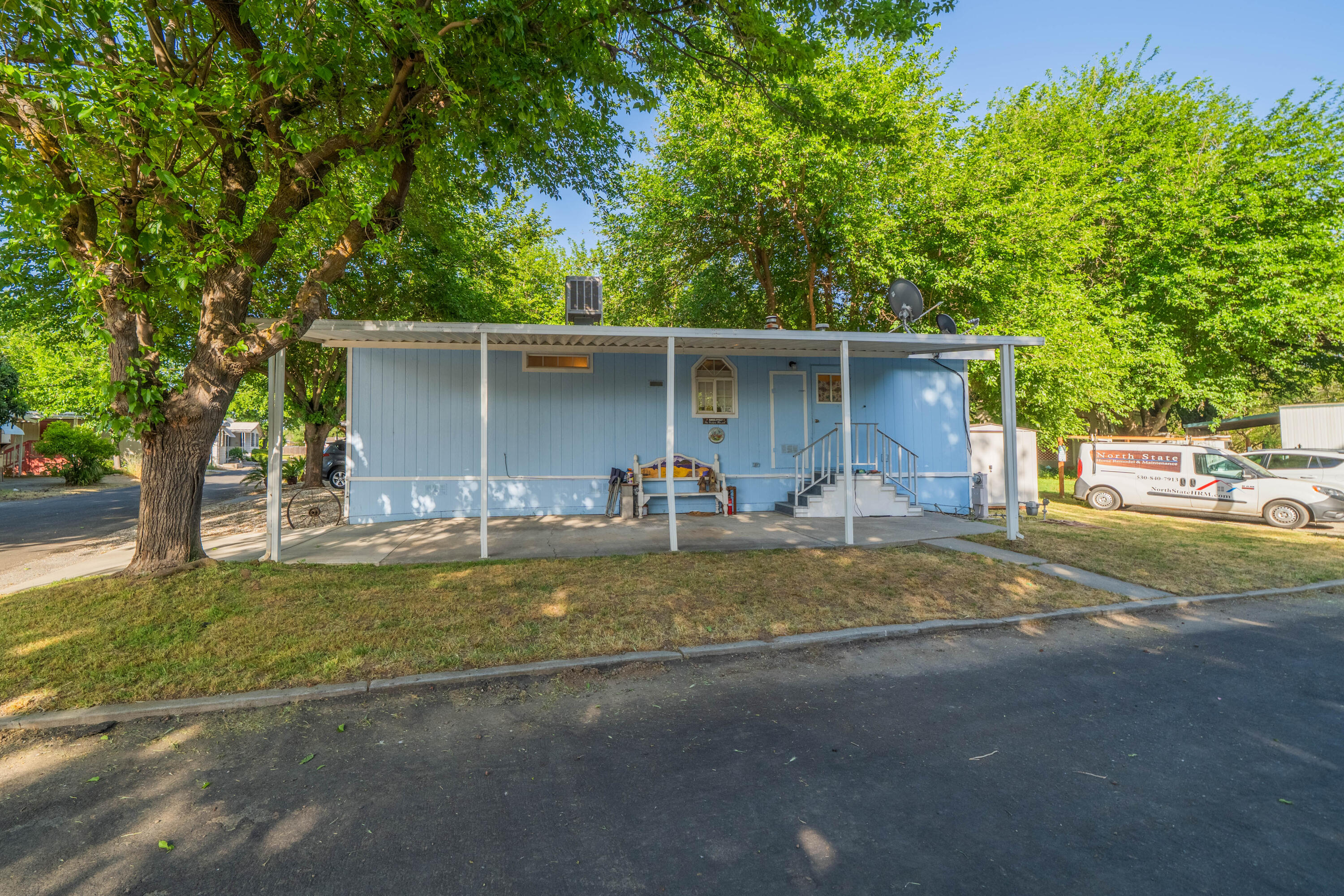 11705 Parey Avenue, Unit 7 Red Bluff, CA 96080 - Photo 23 of 34 a view of a house with backyard and a tree