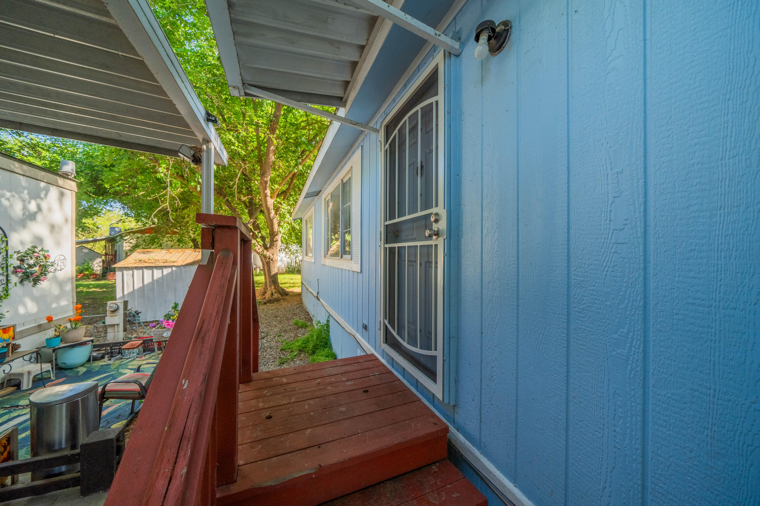 11705 Parey Avenue, Unit 7 Red Bluff, CA 96080 - Photo 4 of 34 a view of deck with wooden floor and outdoor space