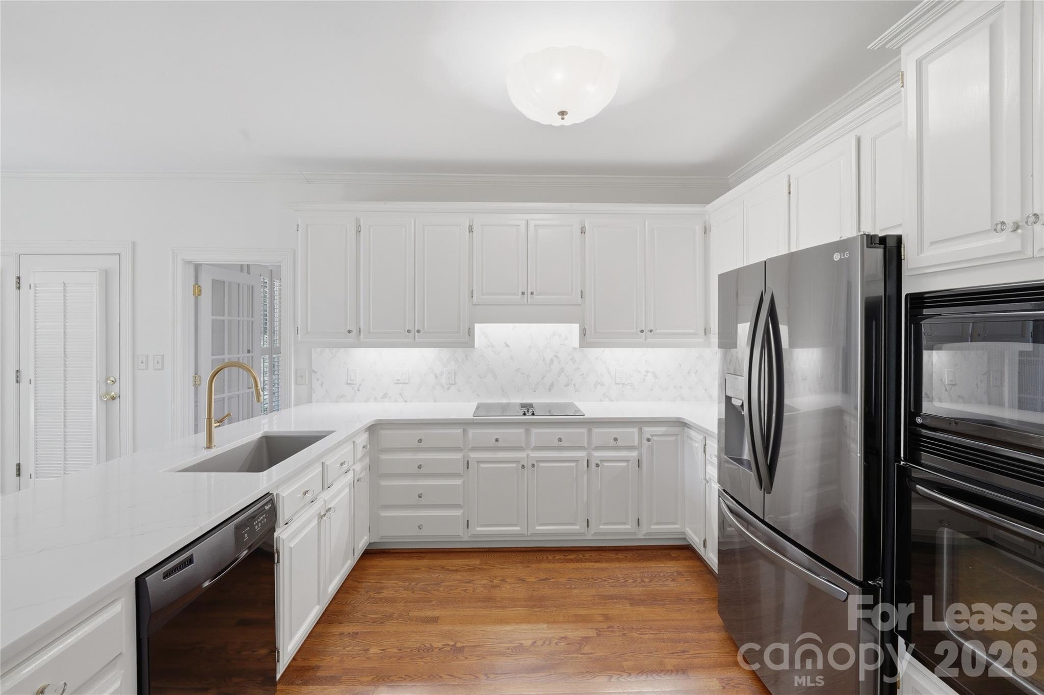 5906 Sharon Hills Road Charlotte, NC 28210 - Photo 15 of 30 a kitchen with stainless steel appliances granite countertop a refrigerator sink and cabinets