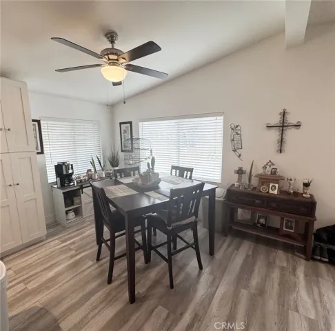 a view of a dining room with furniture and window