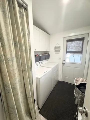 a utility room with a window dryer and washer
