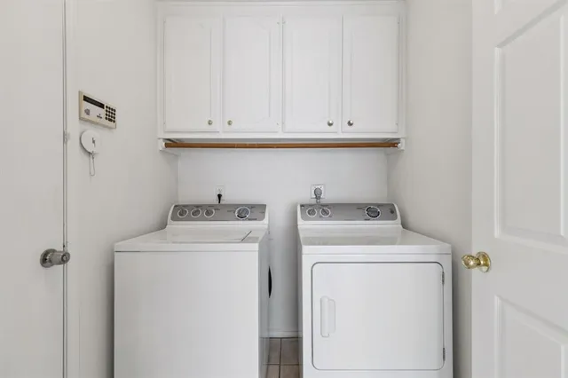 a view of a room with windows and chandelier