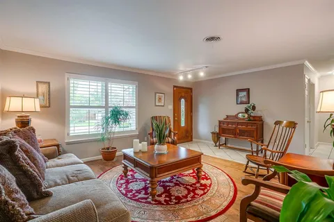 a living room with furniture and a table