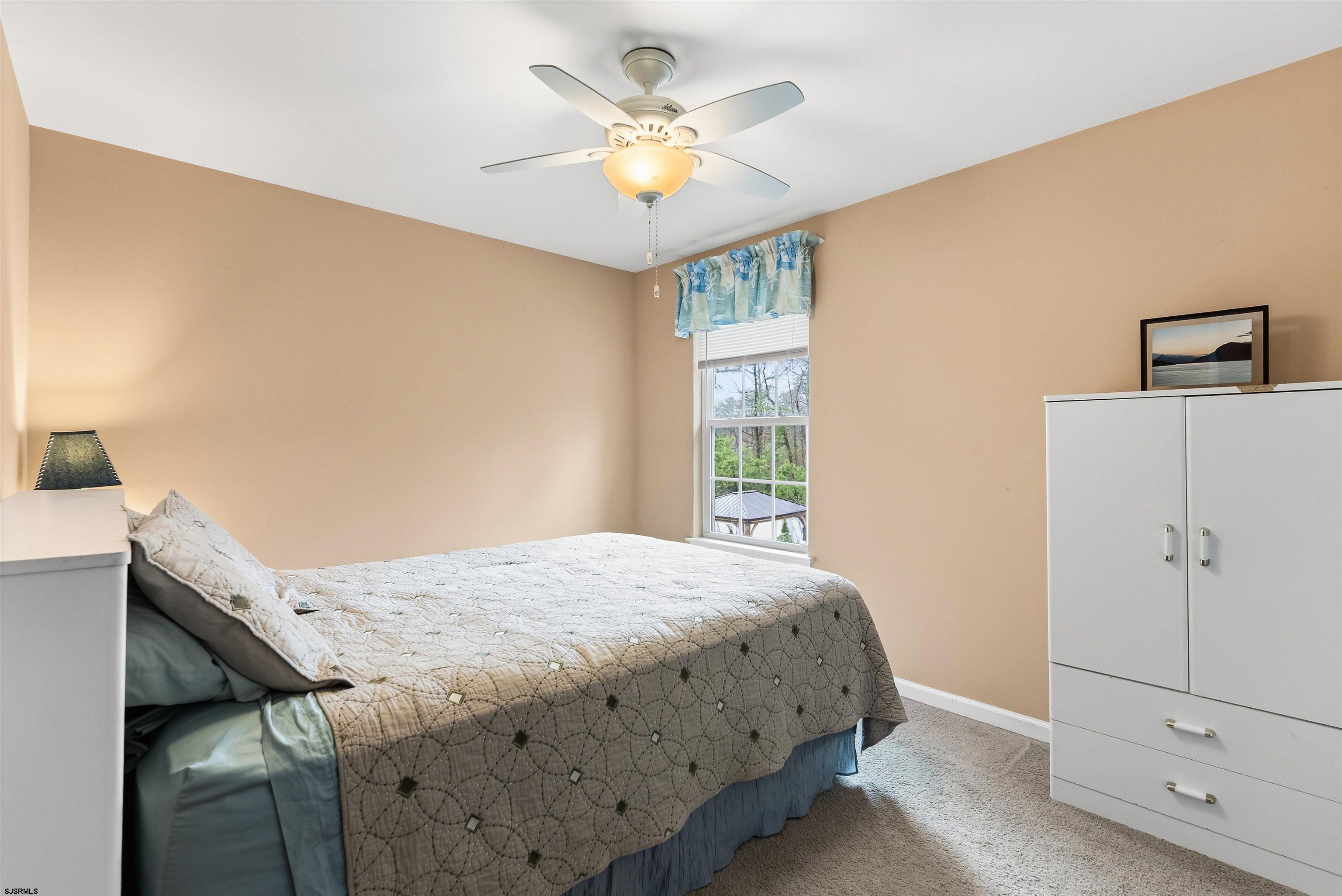 32 Renaissance Drive Mays Landing, NJ 08330 - Photo 21 of 50 a bedroom with a bed and a ceiling fan