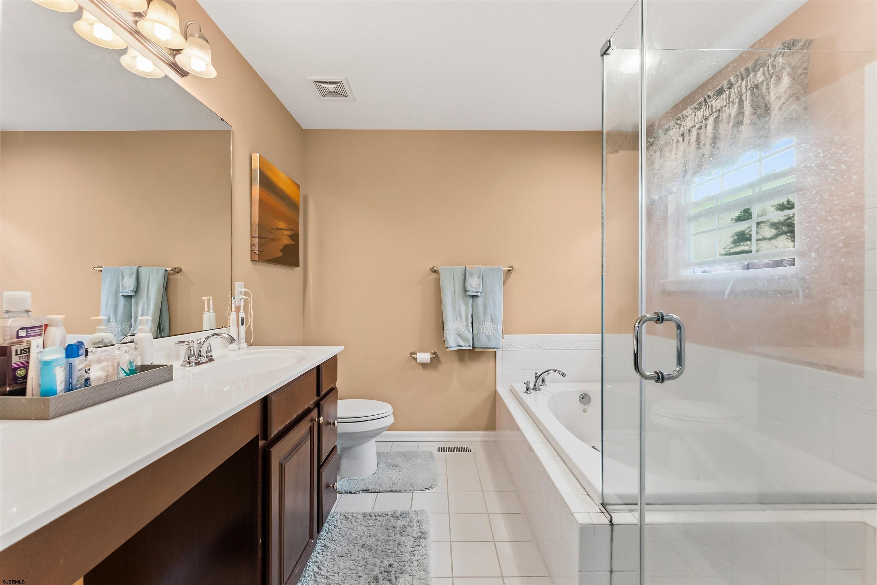 32 Renaissance Drive Mays Landing, NJ 08330 - Photo 28 of 50 a bathroom with a granite countertop sink a toilet and shower