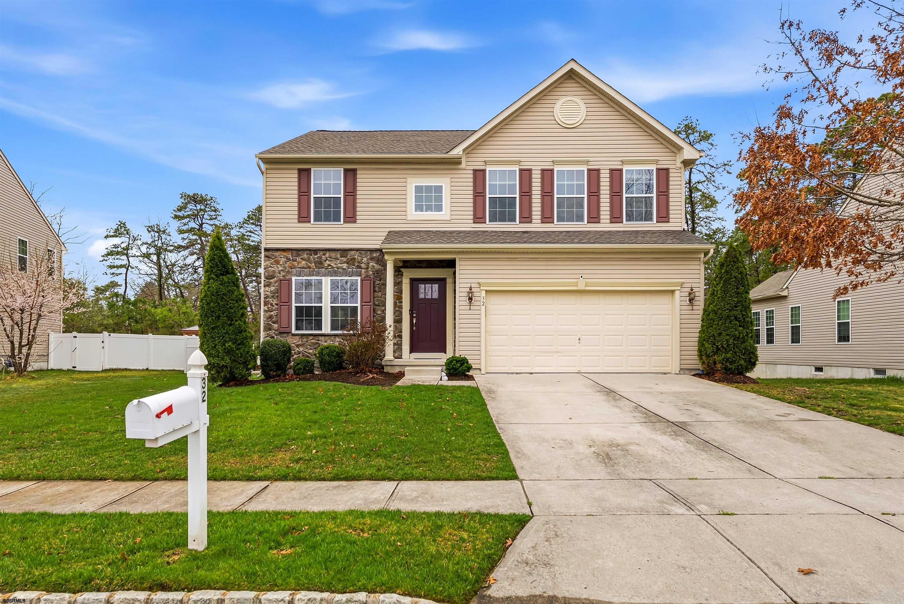 32 Renaissance Drive Mays Landing, NJ 08330 - Photo 3 of 50 a front view of a house with a yard and garage