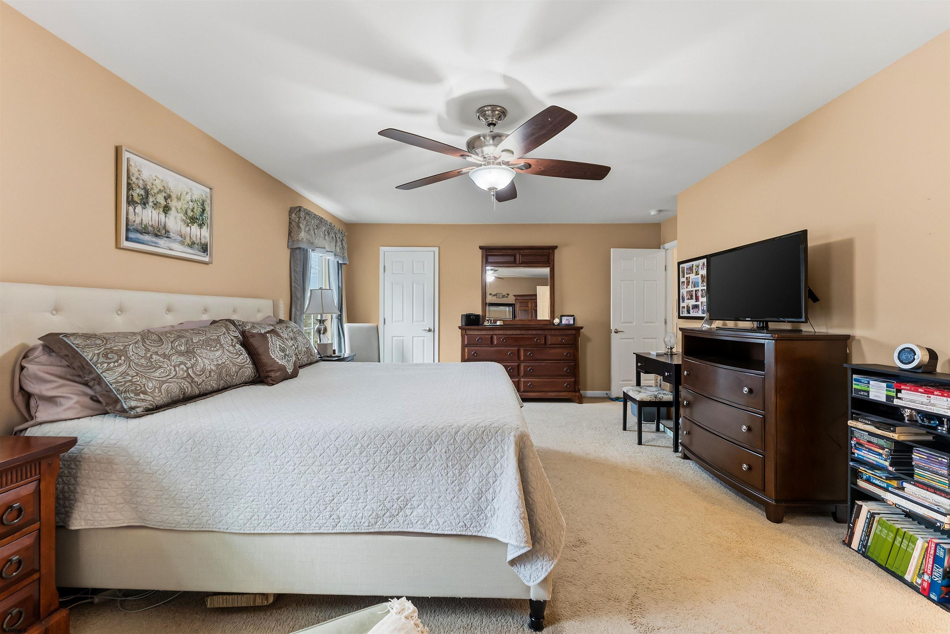 32 Renaissance Drive Mays Landing, NJ 08330 - Photo 31 of 50 a bedroom with a bed and a flat screen tv