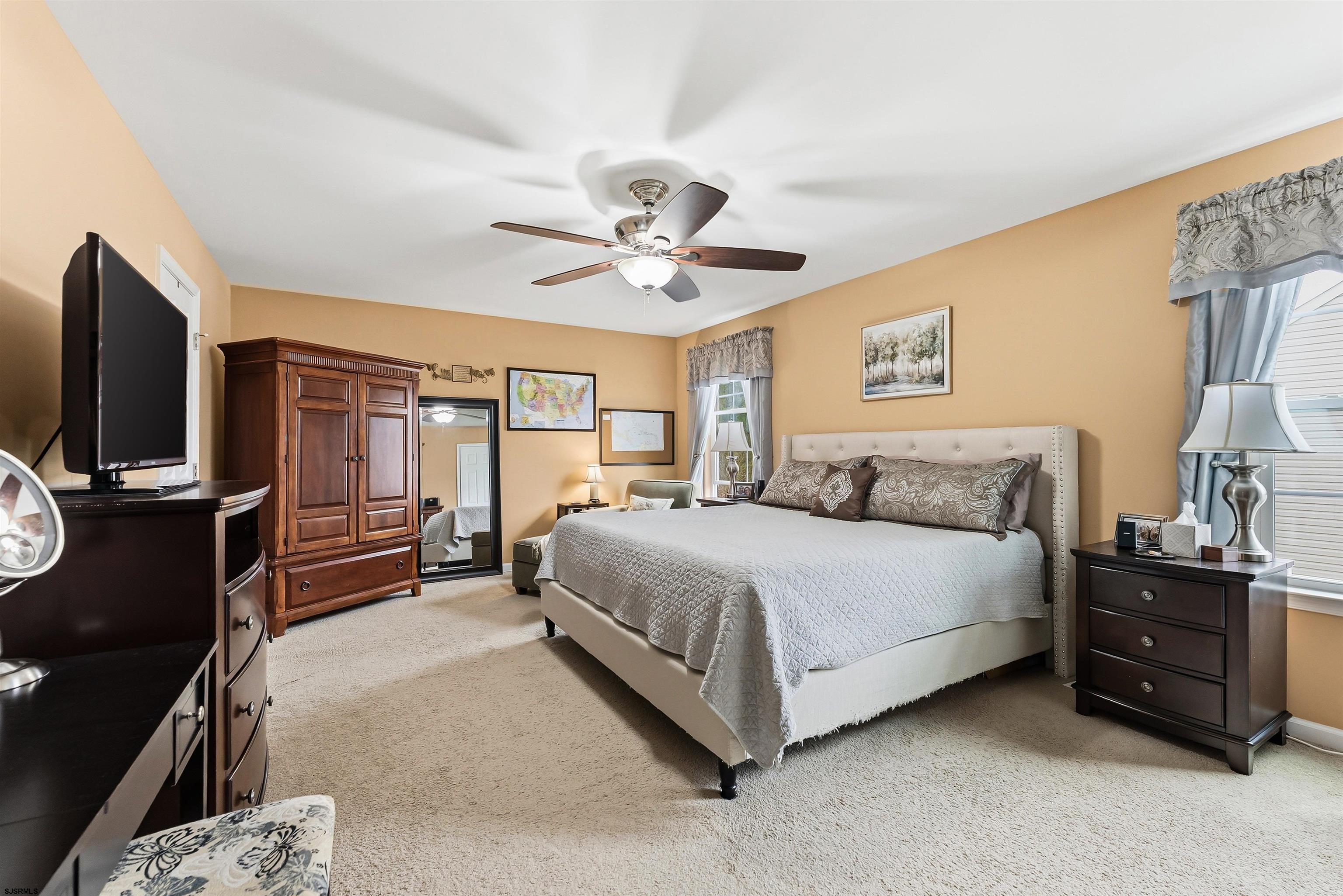 32 Renaissance Drive Mays Landing, NJ 08330 - Photo 33 of 50 a spacious bedroom with a bed and a chandelier