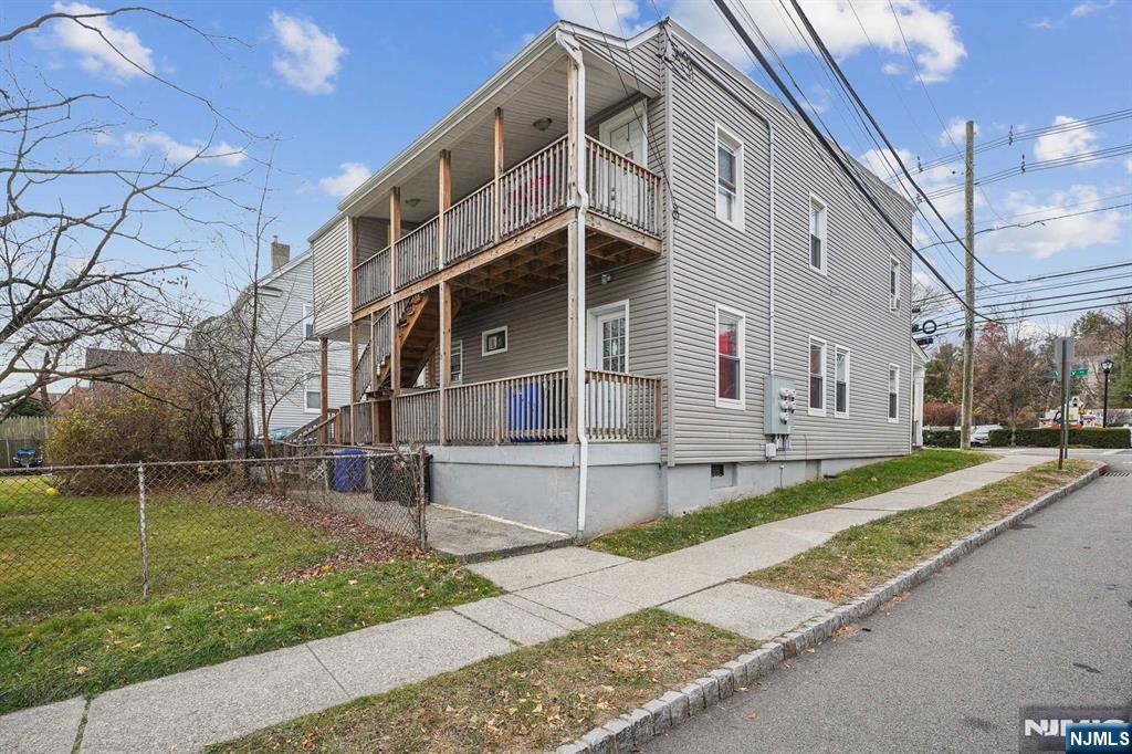 143 Valley Road, Unit 1R Montclair, NJ 07042 - Photo 16 of 18 a view of a white building with a yard